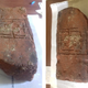 The clay tablet with a game board etched onto it.